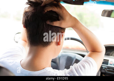 young man have a big trouble while driving car.Transportation concept Stock Photo