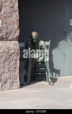 Statue of poor man listening to radio Stock Photo