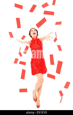 happy chinese new year.young woman trying to catch red envelope for good luck and rich Stock Photo