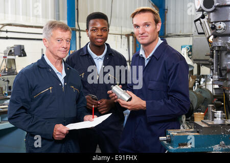 Team Of Engineers Having Discussion In Factory Stock Photo