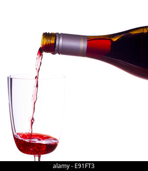 Red wine being poured into glass Stock Photo