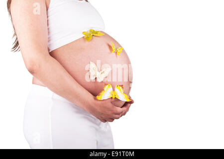 Pretty pregnant woman with butterflies Stock Photo