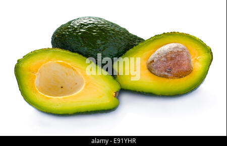 Avocado cut in half against white background Stock Photo