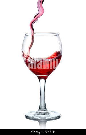 Red wine pouring in glass isolated on white Stock Photo