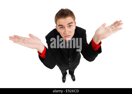 Wide angle top view of a young man showing don't know gesture Stock Photo