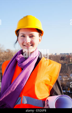 Young lady architect staying outdoors Stock Photo