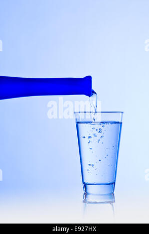 Water glass with a blue bottle Water glass with a blue bottle