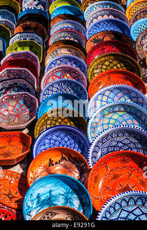 Souvenir Tunisian ceramics displayed on the ground in Port el Kantoui in Tunisia. Stock Photo