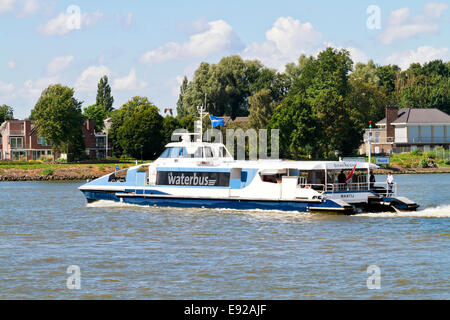 DORDRECHT, NETHERLANDS - AUGUSTUS 11, 2013: Waterbus on the river Merwekade in Dordrecht, a fast ferry from Dordrecht Stock Photo