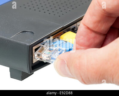Cat 5 cables in multiple colors in router Stock Photo