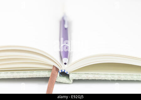 Closeup opened notebook and pen on white background, stock photo Stock Photo