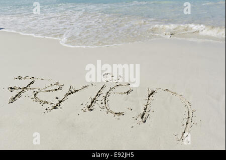 Holiday written in the sand Stock Photo