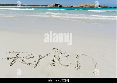 Holiday written in the sand Stock Photo