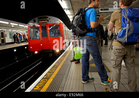 London, England, UK. Travelers with backpacks in a tube station Stock Photo
