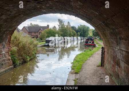 View through a stone road bridge over the Birmingham and Liverpool Junction Canal at Market Drayton Stock Photo