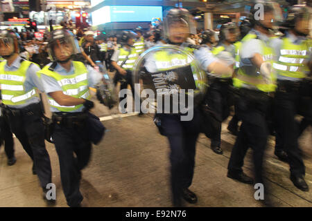 Hong Kong. 17th October, 2014. Hong Kong Protests: Hong Kong riot police charge pro-democracy protesters in Mongkok, Hong Kong Credit:  Robert SC Kemp/Alamy Live News Stock Photo