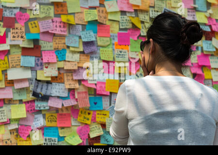 Hong Kong. 17th October, 2014. Protests: Students, pro democracy activists and other supporters of Occupy Central, now called the umbrella movement or the umbrella revolution,remain in the main Tamar protest site also called umbrella square .  Thousands of messages of support are posted along John Lennon Wall. Stock Photo