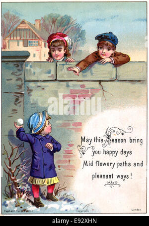 Boy with Snowball, Two Children Behind Wall, 'May the Season Bring you Happy Days', Postcard, circa 1910 Stock Photo