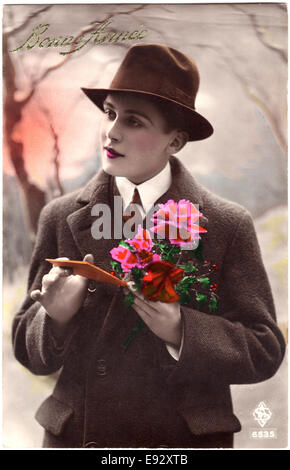 Woman Dressed in Man' Coat and Hat Holding Flowers and Card, 'Bonne France', Hand-Colored French Postcard, circa 1927