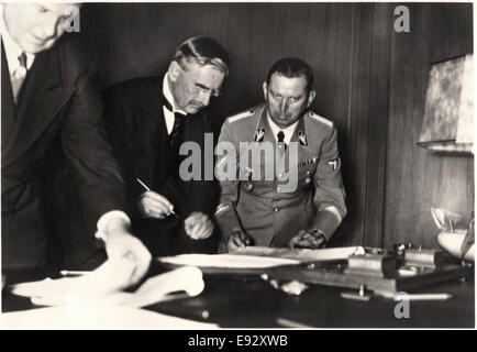 British Prime Minister Neville Chamberlain Signing Munich Agreement, Munich, Germany, September 30, 1938 Stock Photo
