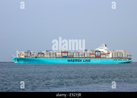 Maersk container ship leaving the port on Sep 6, 2013 in Rotterdam, Netherlands. Stock Photo