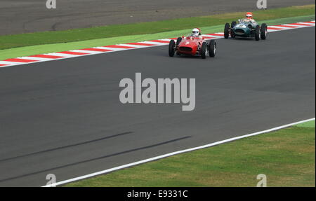 Classic F1 Grand Prix cars during an historic race at Silverstone (Ferrari 246 Dino 007 and Aston Martin DBR4). Stock Photo