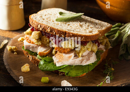 Homemade Leftover Thanksgiving Dinner Turkey Sandwich with Cranberries and Stuffing Stock Photo