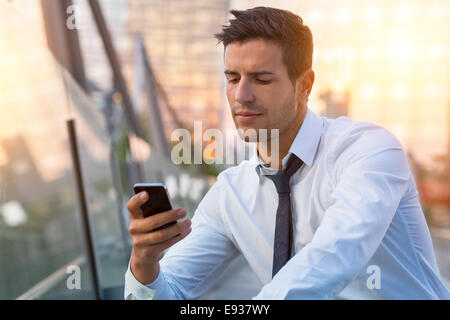 Businessman using cell phone Stock Photo