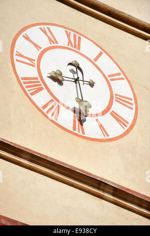 Architecture detail with old church clock tower and blue sky on background Stock Photo