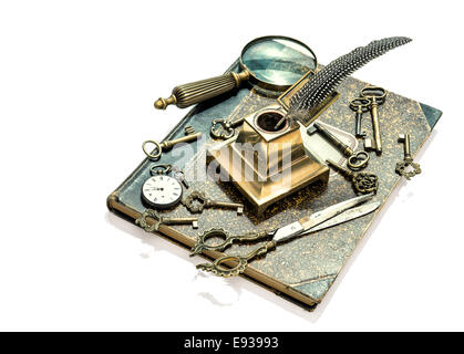 antique keys, pocket watch, ink pen, loupe, book isolated on white background. collectibles and vintage goods. retro style toned Stock Photo