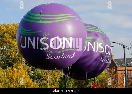 Glasgow, Scotland, UK. 18th October, 2014. The Scottish Trades Union Congress (STUC) organised a protest march starting from Glasgow Green, parading through Glasgow city centre and finally having a rally in George Square to make a political statement about wage cuts, austerity and poverty. Approximately 5000 protesters and members of many Trades Unions took part travelling from all parts of Scotland including Ayrshire, Edinburgh and Stirling. Credit:  Findlay/Alamy Live News Stock Photo