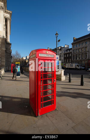 Traditional red telephone box at Whitehall in central London and deep blue sky Stock Photo