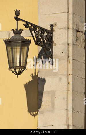 Vertical view of a decorative wrought iron light in Lisbon. Stock Photo