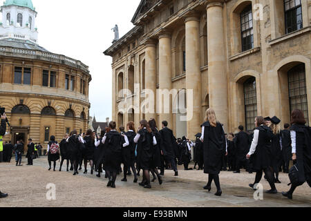 Oxford, UK 18th October. Students of Oxford University on their way to the Matriculation ceremony held in Sheldonian Theater, Oxford Credit: Credit: Pete Lusabia/Alamy Live news Stock Photo