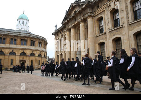 Oxford, UK 18th October. Students of Oxford University on their way to the Matriculation ceremony held in Sheldonian Theater, Oxford Credit: Credit: Pete Lusabia/Alamy Live news Stock Photo