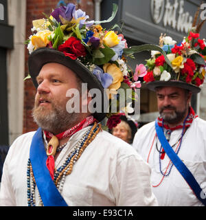 Square portrait of traditional North-West Morris dancers performing a dance routine Stock Photo