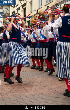 Vertical portrait of traditional North-West Morris dancers performing a formation dance routine Stock Photo