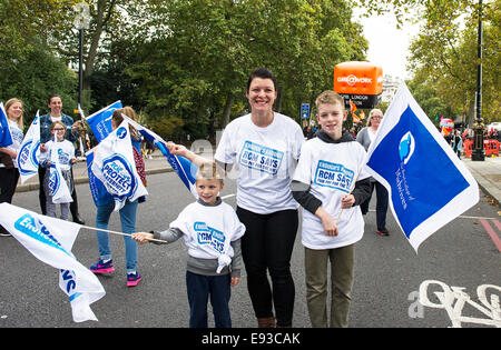 London, UK. 18 October 2014. 'Britain Needs A Payrise'   A TUC national demonstration in Central London.  Sonia Heard, a midwife from Leicester and her two sons, Oliver aged 4 and Ethan, aged 11 prepare to march off from the Embankment. Photo: Gordon Scammell/Alamy Live News Stock Photo