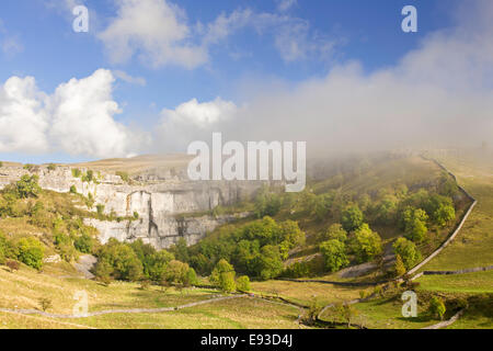 A misty autumn morning over Malham Cove, Malham, Yorkshire Dales National Park, North Yorkshire, England. Stock Photo