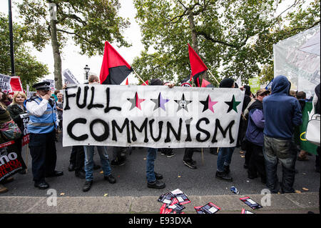 London, UK. 18 October 2014. 'Britain Needs A Payrise'   A TUC national demonstration in Central London.  A banner held by members of Black Bloc as the march prepares to set off from the Embankment. Photo: Gordon Scammell/Alamy Live News Stock Photo