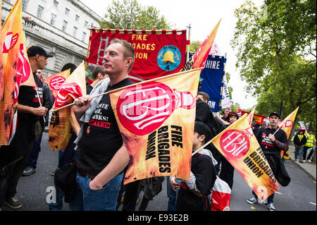 London, UK. 18 October 2014. 'Britain Needs A Payrise'   A TUC national demonstration in Central London.  Members of the Fire Brigade Union wait for the march to set off from the Embankment. Photo: Gordon Scammell/Alamy Live News Stock Photo