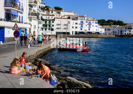 A group of young girls set up a small trinket store on a seaside street in the town of Cadaques. Stock Photo