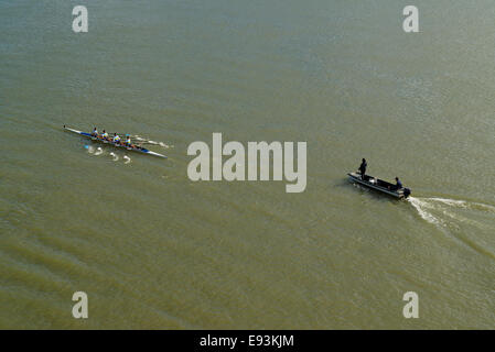 NOVI SAD, SERBIA - OCTOBER 18, 2014: Four men rowing on Danube River in Novi Sad on traditional remote regatta competition. Stock Photo