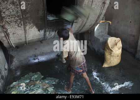 Dhaka, Bangladesh. 18th Oct, 2014. A child name Bahadur age of 11working at a tannery factory in Hazaribagh. Dhaka's Hazaribagh area, widely known for its tannery industry, has been listed as one of the top 10 polluted places on earth with 270 registered tanneries in Bangladesh, and around 90-95 percent are located at Hazaribagh employing 8,000 to 12,000 people. Leather production includes many operations with different exposures, which can be harmful for the health of the workers, and particularly be carcinogenic © Zakir Hossain Chowdhury/ZUMA Wire/Ģ����ý Live News Stock Photo