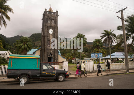 Locals in Levuka high street passing Sacred Heart Church, Ovalau, Fiji Stock Photo