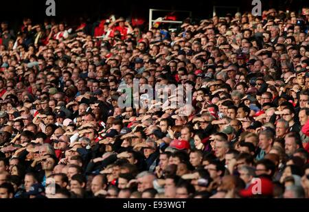 London, UK. 18th Oct, 2014. Football fans are seen in the stands during the Barclays Premier League match be during the Barclays Premier League match between Arsenal and Hull City at Emirates Stadium on October 18, 2014 in London, England. The match ended in 2-2 draw. Credit:  Han Yan/Xinhua/Alamy Live News Stock Photo