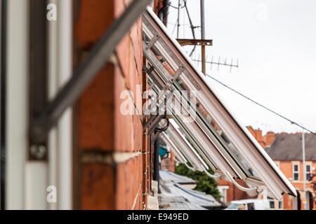 A row of open plastic windows. UPVC window frames, England, UK Stock Photo