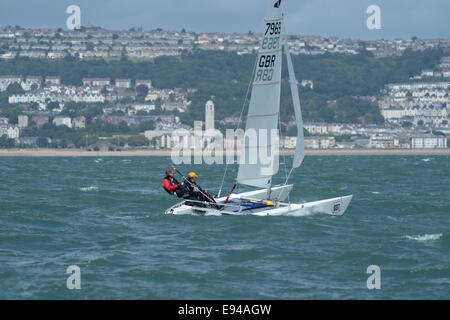 Sailing catamarans dart 18 Europeans 2014 Mumbles Swansea.  Bay and city background Stock Photo