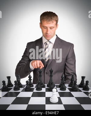 Businessman and chess board Stock Photo