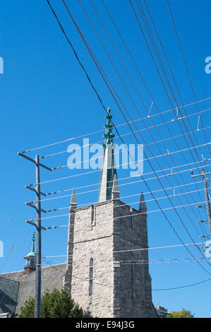 A tangle of unsightly overhead power cables spoil the view of this church in Thunder Bay, Ontario, Canada Stock Photo